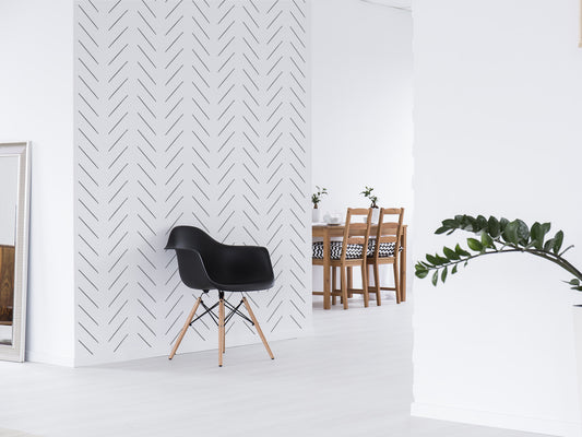 Livia is a monochrome herringbone wallpaper printed on removable peel and stick wallpaper