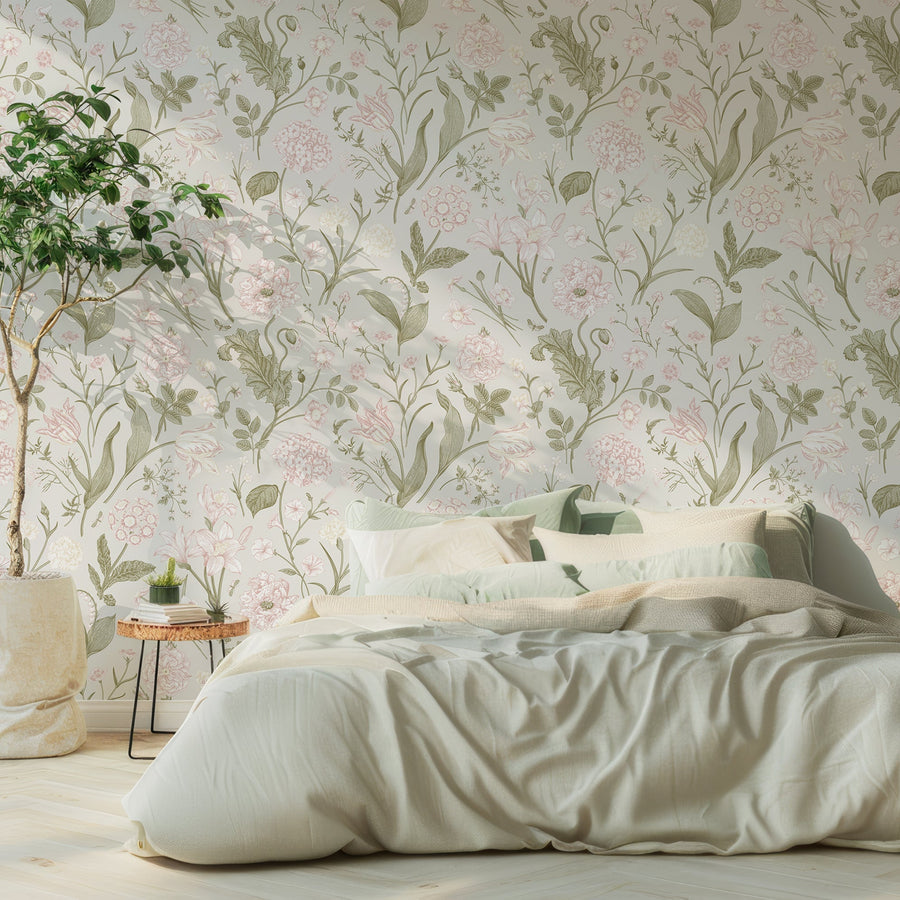 A soft furnished bedroom featuring the Alyssa wallpaper which shows a vintage botanical pink floral blooms, green leaves and delicate stems on a soft washed-out beige background in a repeating pattern.