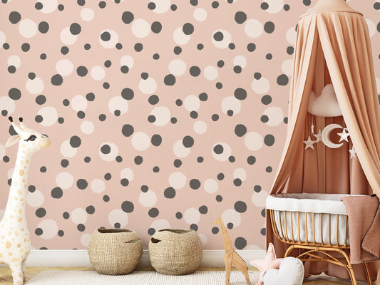 Dorothy Wallpaper In Children's Cot Covered in Beige Fabric With Toy Giraffe