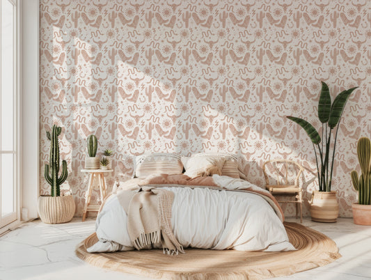 Gracelyn Cowboy Boots And Snake Wallpaper In Western Themed Bedroom With Double Bed With Beige Pillows And Green Plants In Various Sizes Around The Room As Well As Cactuses