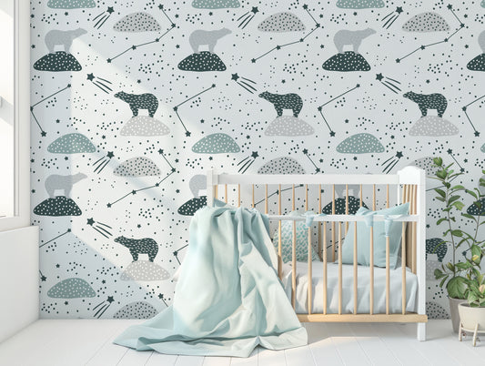 Odette Wallpaper In Nursery Room With Baby Blue Cot & Large Blanket & Green Leafy Plant
