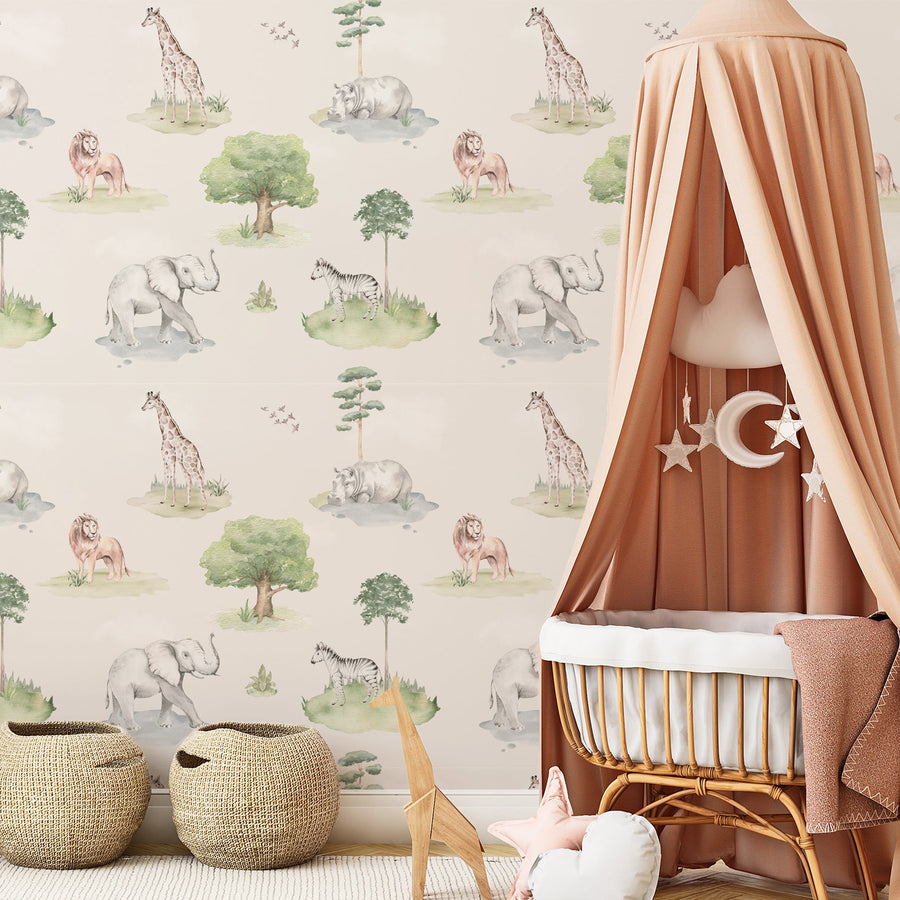 A children's room with a crib and wooden toys featuring 'Zuwena' which is a children's wallpaper featuring watercolour safari animals including elephants, giraffes and lions in soft neutral tones with scattered trees and foliage in a whimsical repeating pattern.