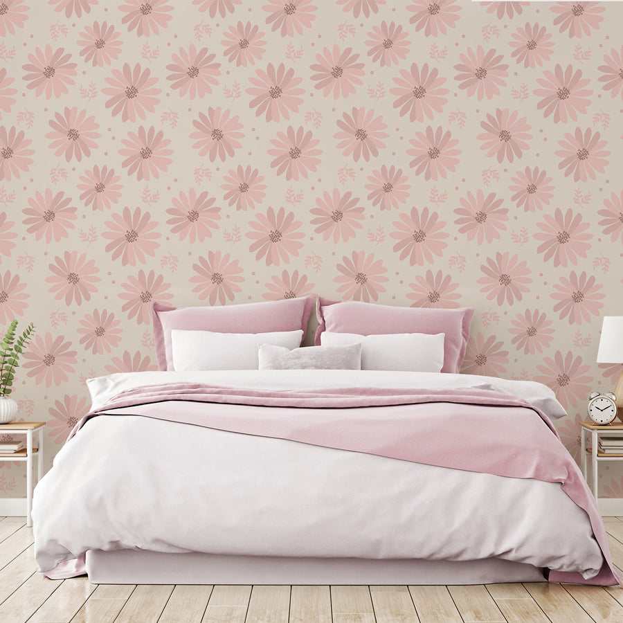A bedroom with a white and pink bedding and low side tables on either side featuring 'Persephone' which is a floral wallpaper featuring blooming white daisy flowers with golden centres and soft green leaves on a neutral background in a cheerful repeating botanical pattern.